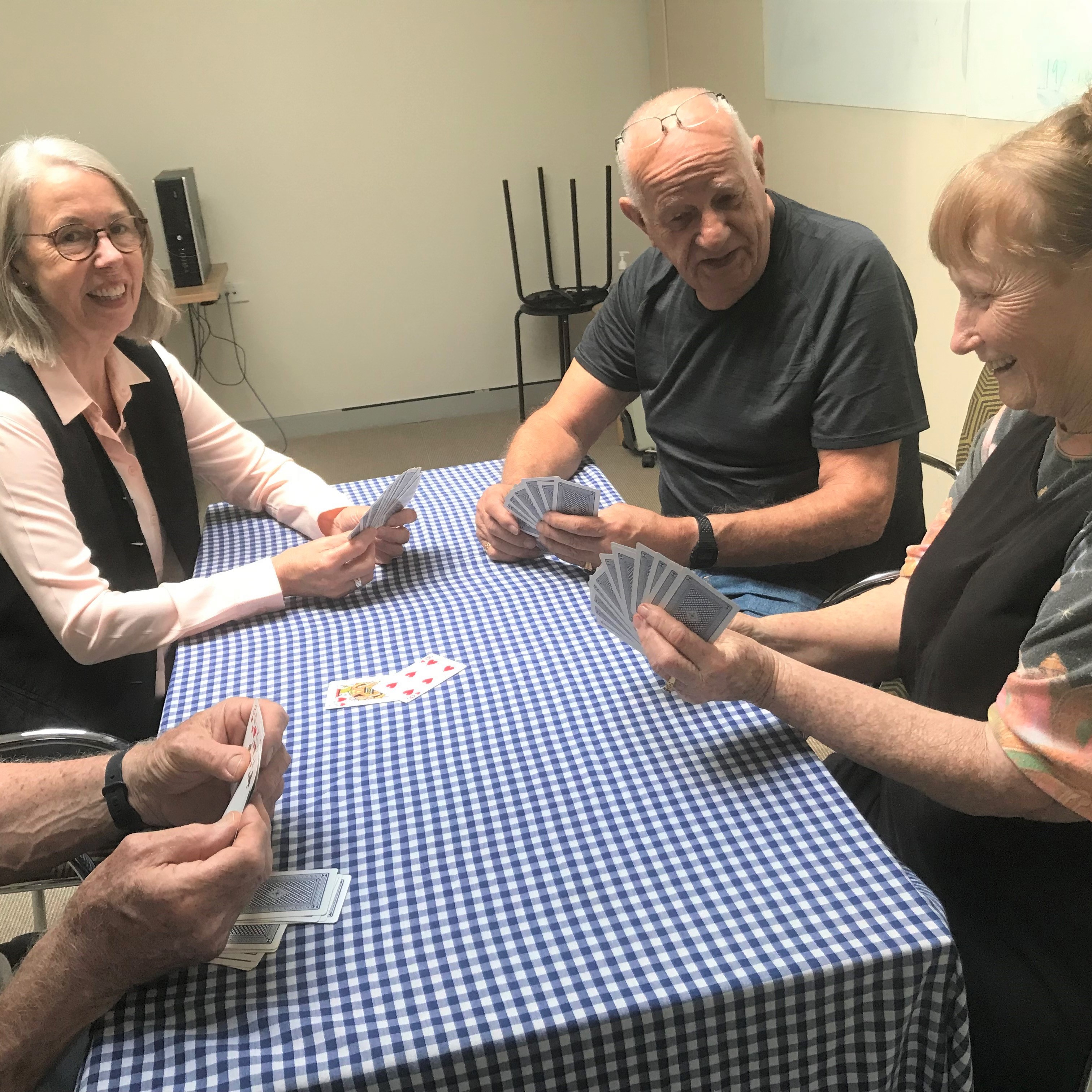 People playing cards around a table